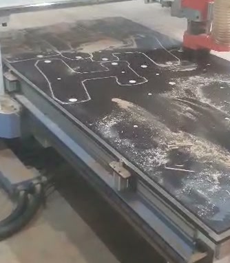 CNC milling machine cutting rocker plate contours