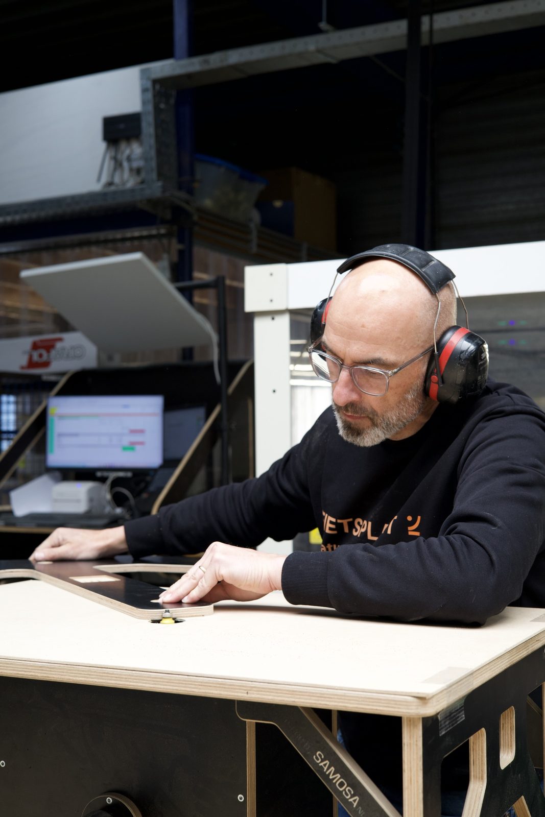 Craftsman working intently on a plate