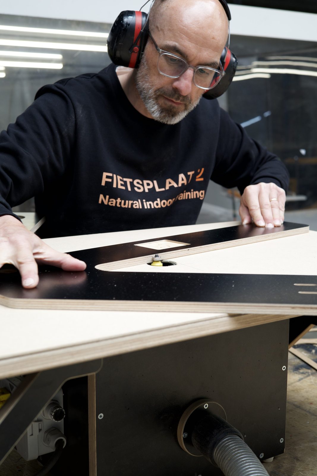 Craftsman working on a Cycleplate rocker plate in the workshop