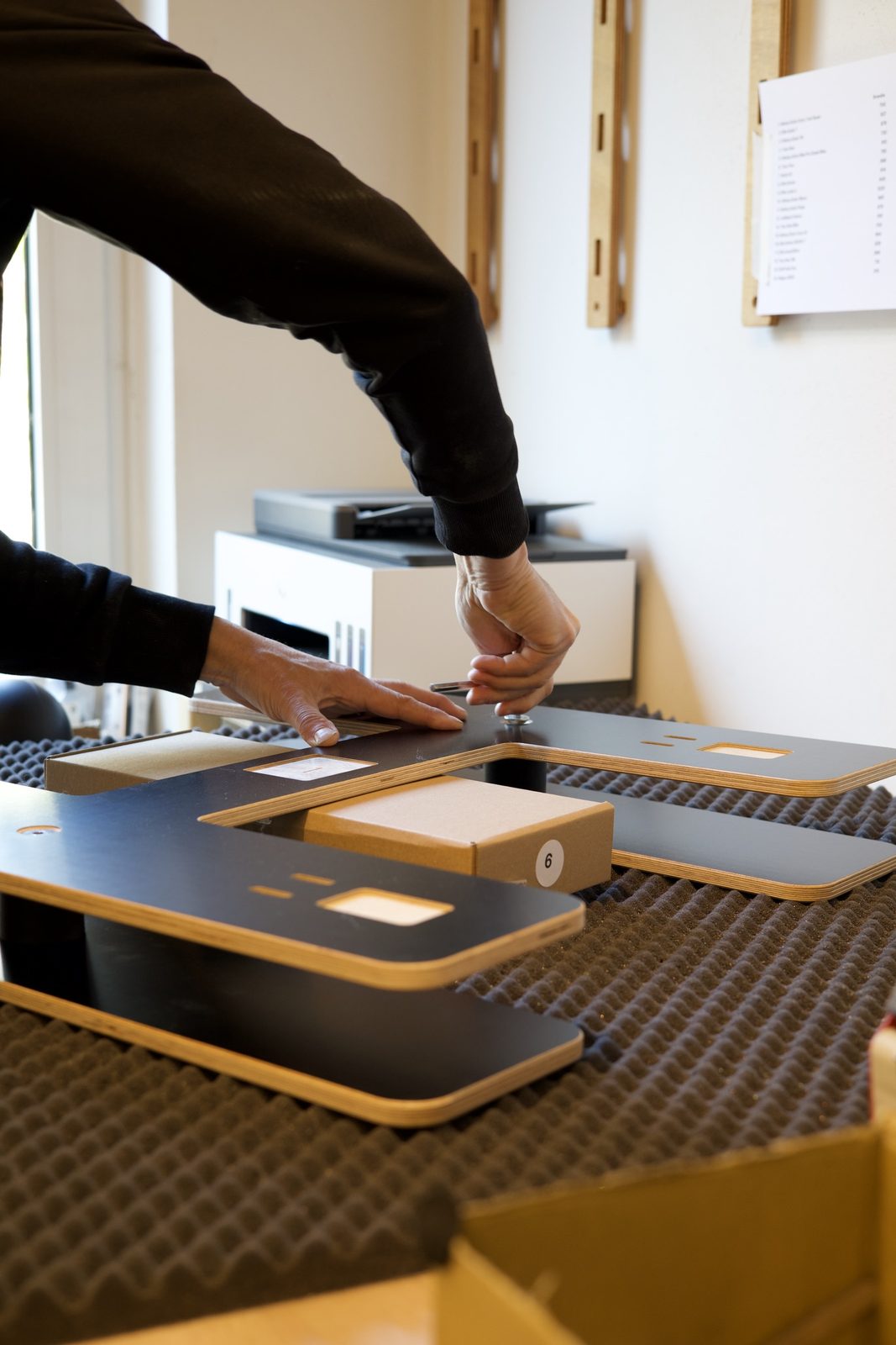 Parts being assembled by hand
